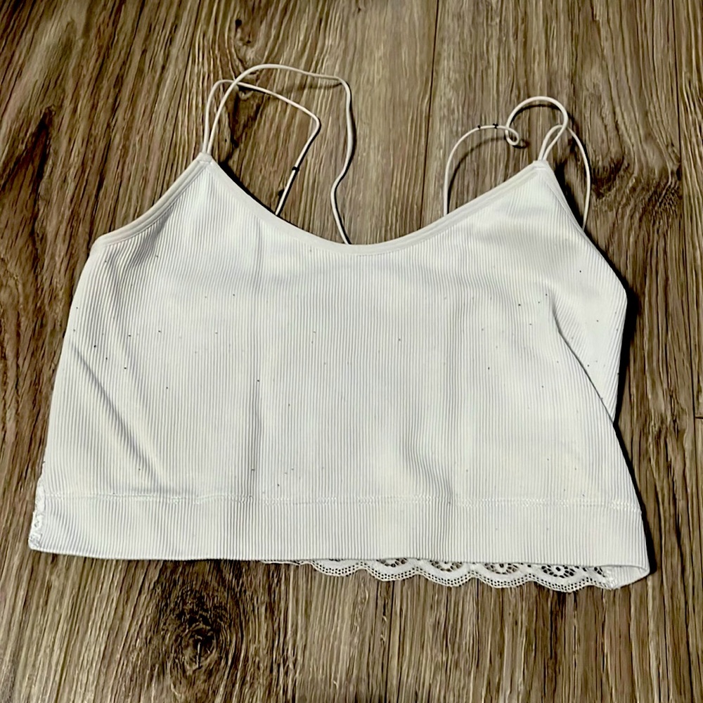white crop top with a flower lace pattern on the back